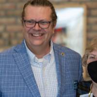 Clayton Pelon poses for a photo with Loretta Konecki